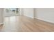 Bright bedroom with light wood floors, white walls, and large windows at 3113 4Th N Ter, St Petersburg, FL 33713