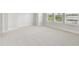 Bedroom showcasing large windows offering plentiful natural light and neutral carpet at 3113 4Th N Ter, St Petersburg, FL 33713