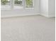 Cozy bedroom with plush carpet and multiple windows providing natural light at 3113 4Th N Ter, St Petersburg, FL 33713