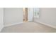 Cozy bedroom with neutral carpet, base trim and natural light creating a serene environment at 3113 4Th N Ter, St Petersburg, FL 33713