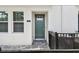Townhome exterior showcasing a green front door, window, and paved pathway at 3113 4Th N Ter, St Petersburg, FL 33713