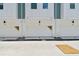 View of the townhome garages, each marked with its unit number and promotional 'Available' stickers at 3113 4Th N Ter, St Petersburg, FL 33713