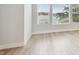 Bright living room features large windows and neutral-toned hardwood floors at 3113 4Th N Ter, St Petersburg, FL 33713
