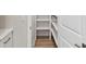 Hall pantry with white shelving and wood floors at 3113 4Th N Ter, St Petersburg, FL 33713