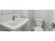 Powder room featuring a floating white vanity, round faucet and a modern, low-flow toilet at 3113 4Th N Ter, St Petersburg, FL 33713