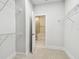 Spacious walk-in closet with metal shelving and an adjoining bathroom with a glass-enclosed shower at 3113 4Th N Ter, St Petersburg, FL 33713