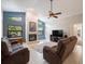 The living room offers a cozy fireplace, high ceilings, and tile flooring at 3171 Roxmere Dr, Palm Harbor, FL 34685