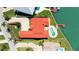 Aerial view of a luxury waterfront home featuring a private pool and boat dock on a canal at 320 Bath Club Blvd S, North Redington Beach, FL 33708