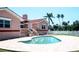 Backyard with an in-ground pool, green grass, and landscaping in the property at 320 Bath Club Blvd S, North Redington Beach, FL 33708