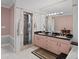 Bathroom featuring double sinks, and a marble shower at 320 Bath Club Blvd S, North Redington Beach, FL 33708