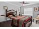 Cozy bedroom with decorative ceiling fan, neutral colors, and a large window at 320 Bath Club Blvd S, North Redington Beach, FL 33708