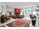 Spacious living room with tile floors, fireplace, views and comfortable seating at 320 Bath Club Blvd S, North Redington Beach, FL 33708