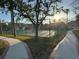 Community tennis courts with lush landscaping, sidewalks, and partial sun, provide a great recreational amenity at 320 Bath Club Blvd S, North Redington Beach, FL 33708