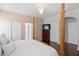 This primary bedroom features a four-poster bed, hardwood floors, and closet at 3321 Mapleridge Dr, Lutz, FL 33558
