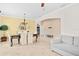 Open-concept dining area with tile flooring, stylish chandelier, and a seamless transition to the living spaces at 3321 Mapleridge Dr, Lutz, FL 33558