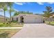 Inviting single-story home with a spacious three-car garage and well-maintained landscaping in a desirable neighborhood at 3321 Mapleridge Dr, Lutz, FL 33558
