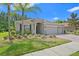 Charming single-Gathering home with a well-manicured lawn, mature landscaping, and a spacious three-car garage at 3321 Mapleridge Dr, Lutz, FL 33558