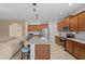 Well-designed kitchen with a large island, granite countertops, stainless steel appliances, and breakfast bar at 3321 Mapleridge Dr, Lutz, FL 33558