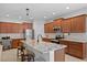 Modern kitchen featuring granite countertops, stainless steel appliances, and a breakfast bar with seating at 3321 Mapleridge Dr, Lutz, FL 33558