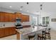 Well-equipped kitchen with a large island, granite countertops, stainless steel appliances, and breakfast bar at 3321 Mapleridge Dr, Lutz, FL 33558