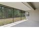 Spacious screened porch offering scenic views of the lush backyard and serene surroundings at 3321 Mapleridge Dr, Lutz, FL 33558