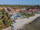 Aerial view of community featuring waterfront, beach, community pool and condo buildings at 3540 42Nd S St # F, St Petersburg, FL 33711