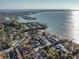 Stunning aerial view showcasing the community's waterfront location, homes, and the beautiful coastline at 3540 42Nd S St # F, St Petersburg, FL 33711