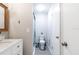 Bathroom featuring a vanity with white cabinets, toilet, and walk-in shower at 3540 42Nd S St # F, St Petersburg, FL 33711