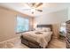Bedroom features a window, ceiling fan, and hard wood floors at 3540 42Nd S St # F, St Petersburg, FL 33711