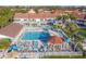 Aerial view of a community pool, gazebo and lounge chairs between condos and the bay at 3540 42Nd S St # F, St Petersburg, FL 33711