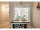 Cozy dining area next to a window complete with a bar with wine storage at 3540 42Nd S St # F, St Petersburg, FL 33711
