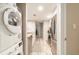 Galley kitchen with stainless appliances, light countertops, and washer/dryer combo near the entry at 3540 42Nd S St # F, St Petersburg, FL 33711