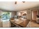 Open-concept living room featuring a dining area, modern kitchen, and inviting decor at 3540 42Nd S St # F, St Petersburg, FL 33711