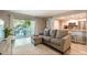 Comfortable living room with a plush sectional sofa and sliding glass doors to the patio at 3540 42Nd S St # F, St Petersburg, FL 33711