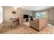 Stylish living room with modern furnishings, a TV, and sliding glass doors to the patio at 3540 42Nd S St # F, St Petersburg, FL 33711