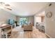 Cozy living room featuring modern furnishings, an open kitchen, and a ceiling fan at 3540 42Nd S St # F, St Petersburg, FL 33711