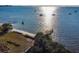 Beautiful waterfront view with boats sailing on calm waters, a sandy beach and pier at 3540 42Nd S St # F, St Petersburg, FL 33711