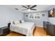 Comfortable bedroom with hardwood floors, ceiling fan, and ample natural light at 3614 S Lois Ave, Tampa, FL 33629