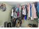 Walk-in closet with lots of hanging clothes and accessories at 3614 S Lois Ave, Tampa, FL 33629