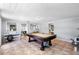 Spacious game room with a pool table, neutral walls, and tile flooring at 3614 S Lois Ave, Tampa, FL 33629