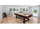 Game room with a pool table, multiple windows, and access to the outdoors at 3614 S Lois Ave, Tampa, FL 33629