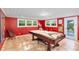 Spacious game room with billiard table, and large windows for plenty of natural light at 3614 S Lois Ave, Tampa, FL 33629