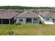 Expansive backyard with a covered patio, perfect for outdoor living and entertaining at 5858 Shorebird Br, Land O Lakes, FL 34638