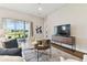 Inviting living room with sliding glass doors leading to a patio, providing picturesque outdoor views at 5858 Shorebird Br, Land O Lakes, FL 34638