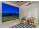Outdoor patio at night with peaceful views of the lake, lawn, and neighborhood beyond at 5858 Shorebird Br, Land O Lakes, FL 34638