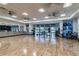 Bright yoga studio with wood floors, mirrors, and exercise equipment at 5858 Shorebird Br, Land O Lakes, FL 34638