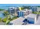 Breathtaking aerial view of a waterfront condo building with a pool and marina access at 6 Belleview Blvd # 505, Belleair, FL 33756