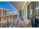 Large, shaded condo balcony with ample seating and views of the city and the neighboring high-rise at 6 Belleview Blvd # 505, Belleair, FL 33756