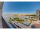 Enjoy stunning waterfront views from this condo's spacious balcony overlooking the pool and lush landscaping at 6 Belleview Blvd # 505, Belleair, FL 33756