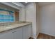 Bright bathroom with a vanity with granite counters, good storage, and a neutral color palette at 6 Belleview Blvd # 505, Belleair, FL 33756